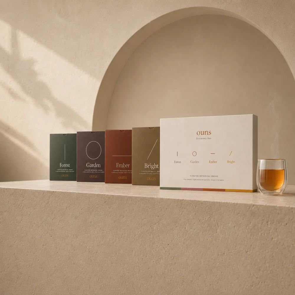 ouns Discovery Box with Garden, Ember, Forest and Bright portions, beside a brewed infusion